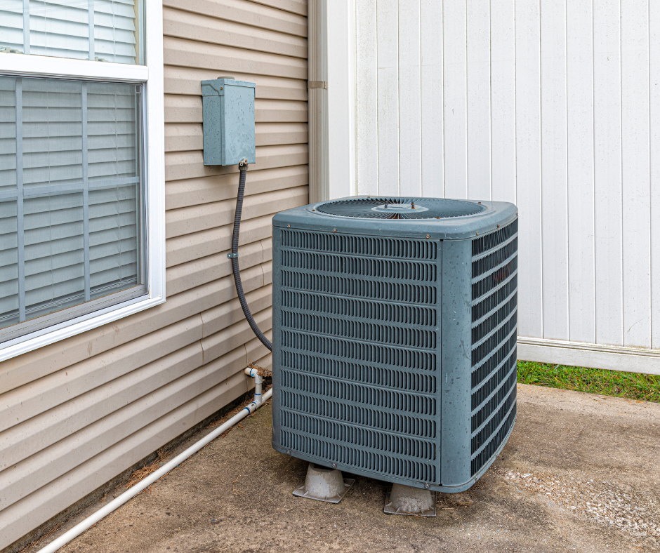 The AC compressor is located outside of the home